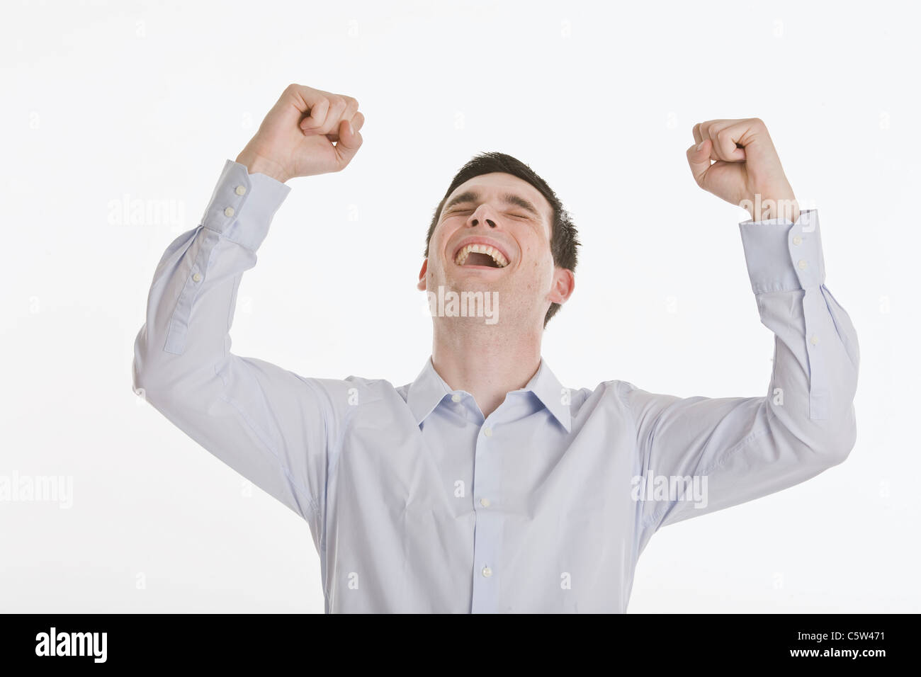 Businessman cheering, portrait Stock Photo - Alamy