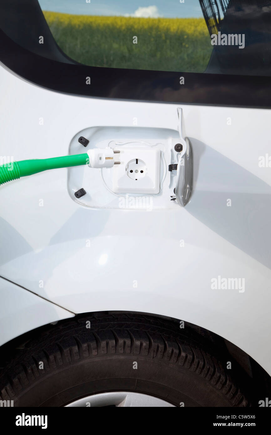 Close up of electric socket and plug of electric car Stock Photo - Alamy