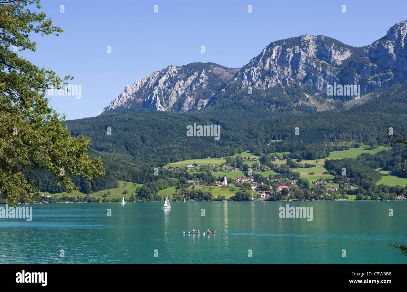 Austria, Salzkammergut, View of steinbach am attersee and attersee lake with hoellen mountains in background Stock Photo