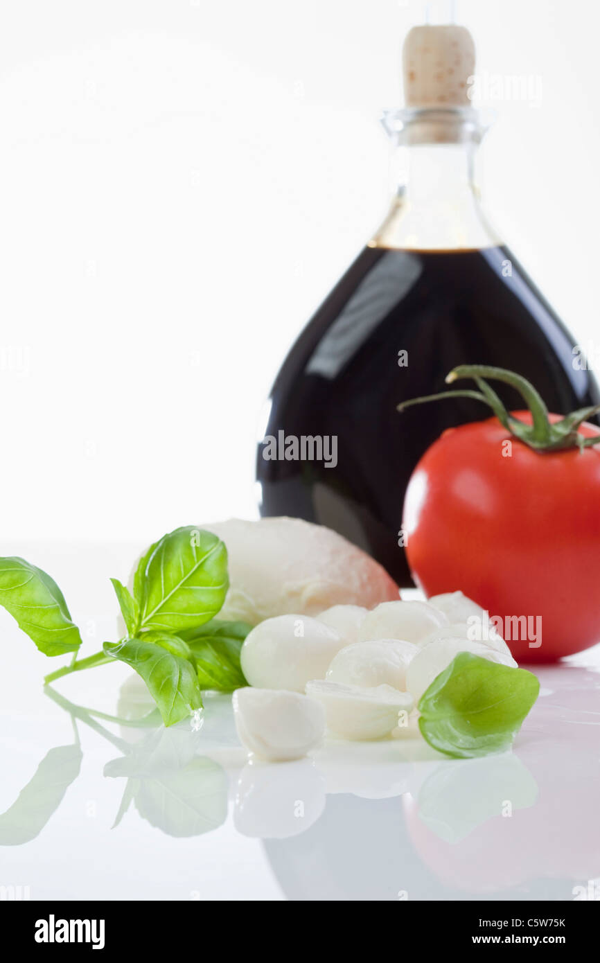 Mozzarella cheese, basil leaves and vinegar Stock Photo Alamy