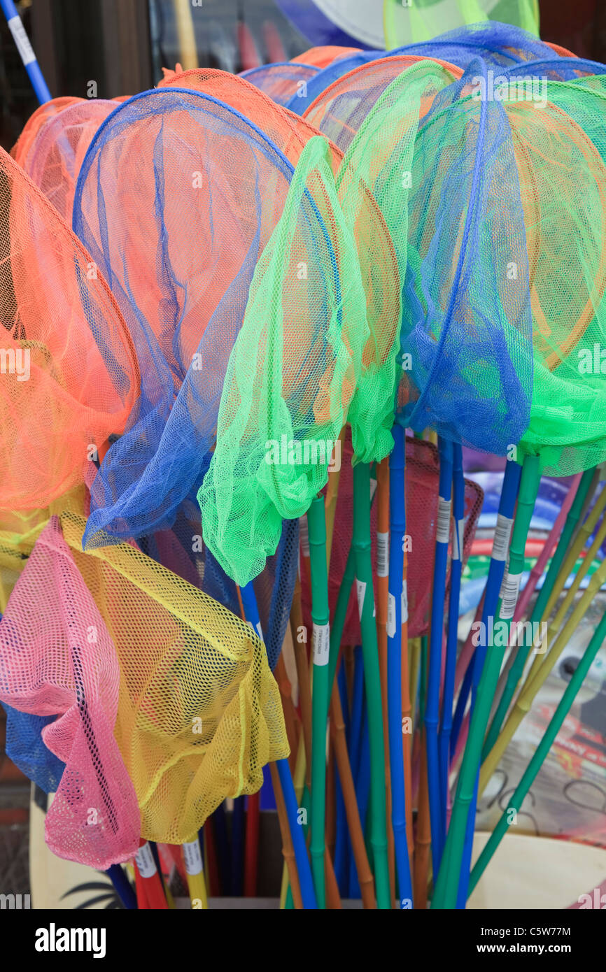 Colourful, childrens' fishing nets for a fun trip down to the stream or  seaside! Stock Photo - Alamy