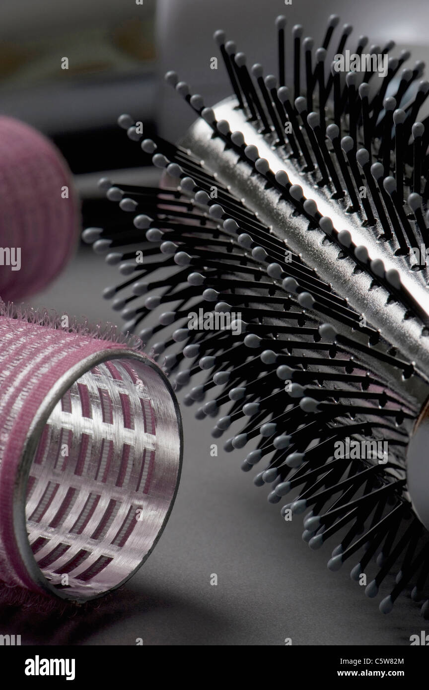 Hairbrush and curlers, close-up Stock Photo