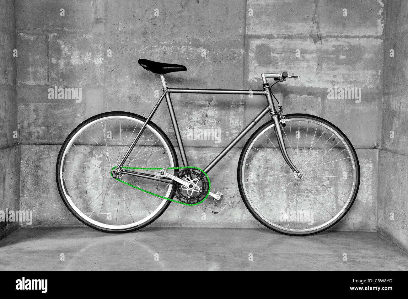 A fixed gear bicycle, also called fixie, with a green chain, ecology concept Stock Photo
