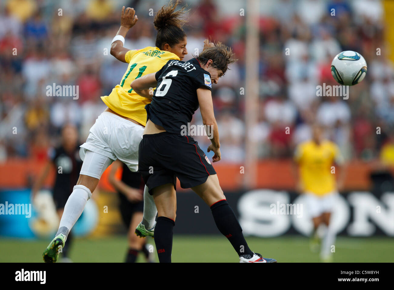 Cristiane of Brazil (l) and Amy LePeilbet of the USA (r) contest a header during a 2011 Women's World Cup quarterfinal match. Stock Photo