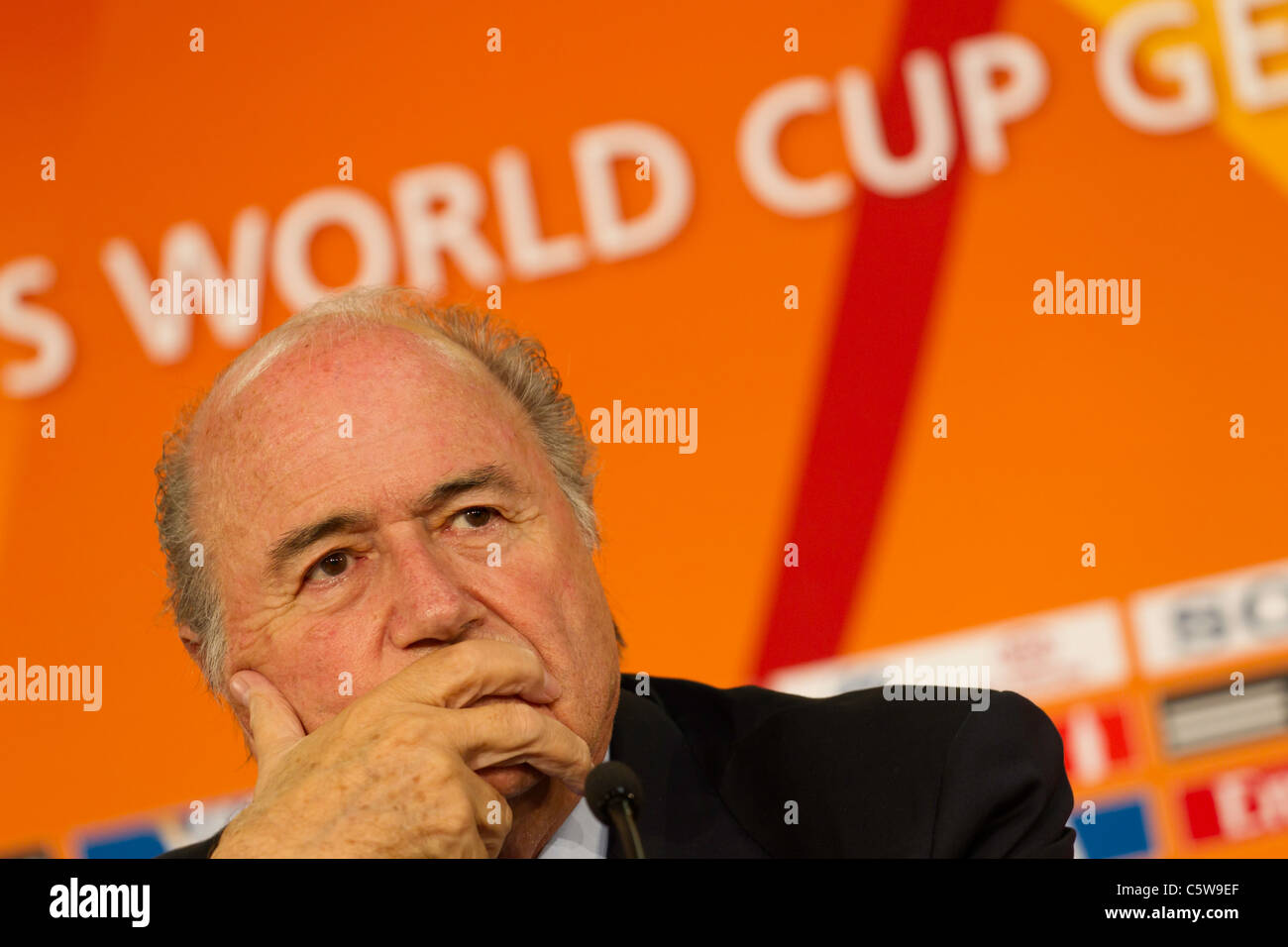 FIFA President Joseph Blatter listens to a question at the opening press conference of the 2011 Women's World Cup tournament. Stock Photo