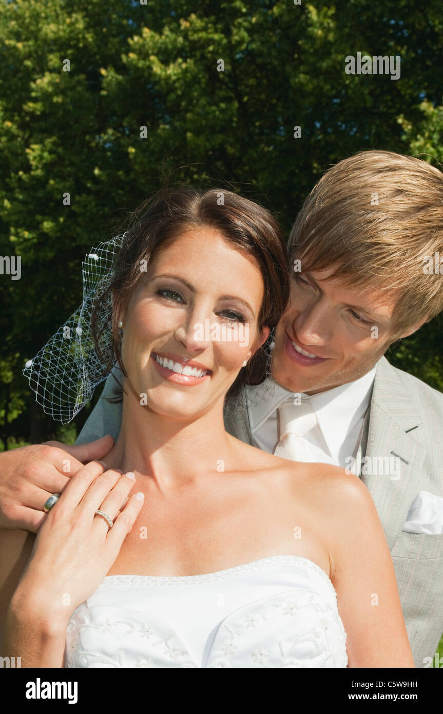Smiling groom touching head hi-res stock photography and images - Alamy