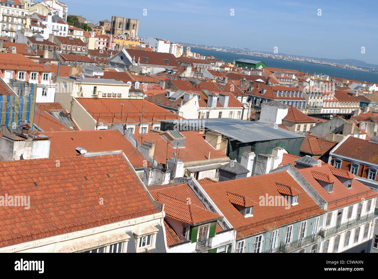 The rooftops of Lisbon's commercial district with cathedral top left Stock Photo