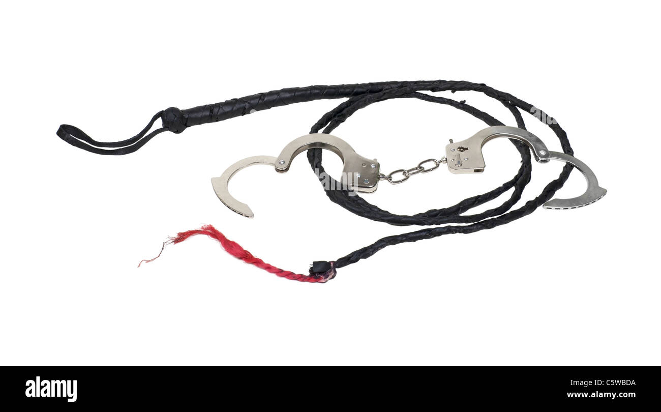 Whip made of woven leather and metal handcuffs - path included Stock Photo