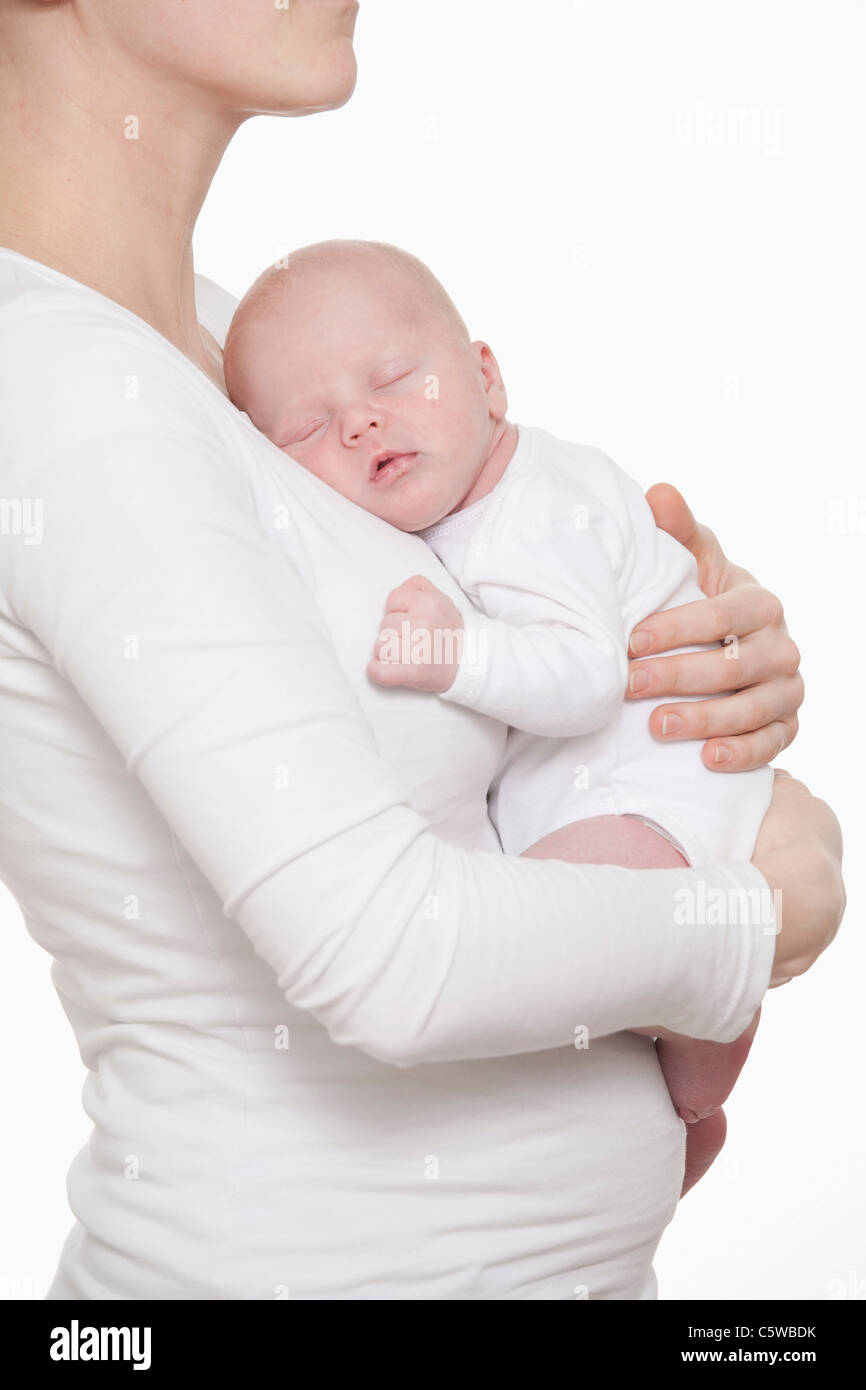 Germany, Munich, Mother holding (0-1 months) newborn baby boy Stock Photo