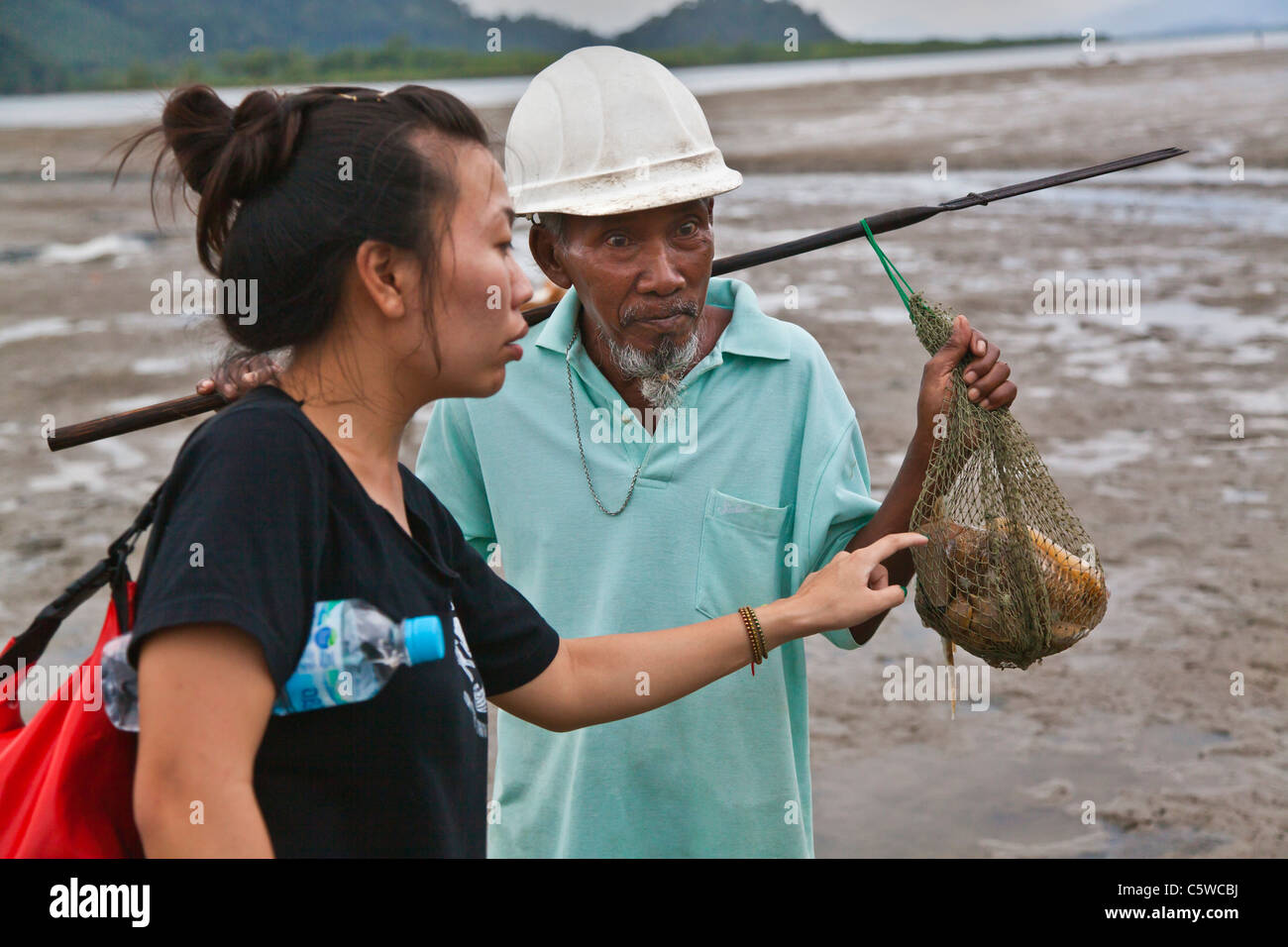 A local fisherman shows off his catch near the village of Ben Lion on KOH PHRA THONG ISLAND - THAILAND Stock Photo