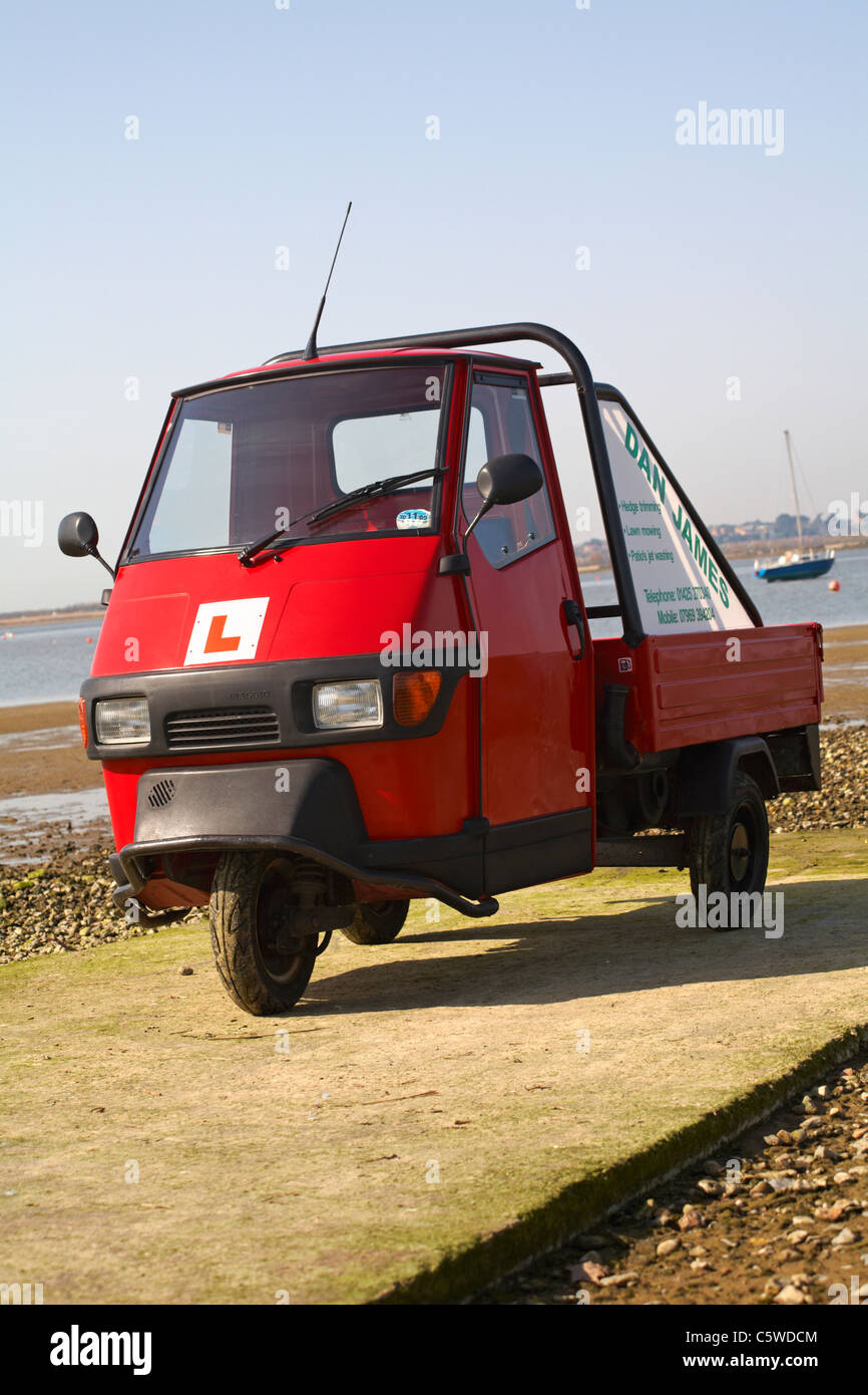 Piaggio Ape vehicle with L plates parked on slipway at Mudeford in March Stock Photo