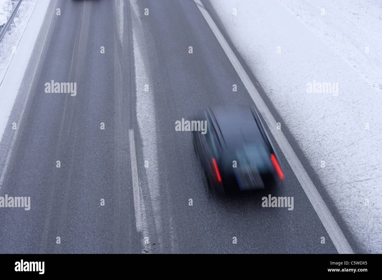 Germany, Upper Bavaria, Bundesautobahn 95, German Autobahnen, Car moving in speed on highway Stock Photo