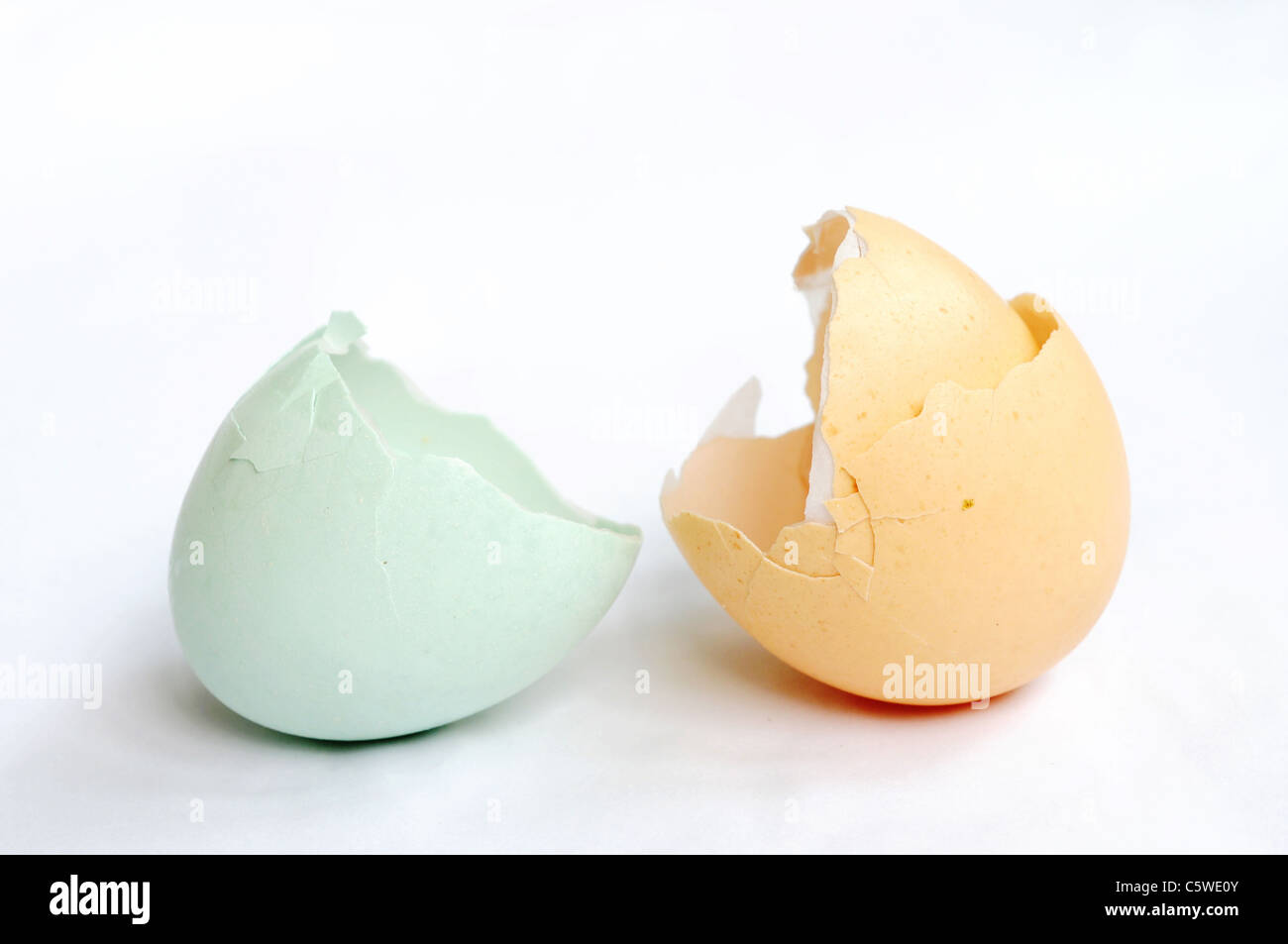 Broken empty eggshells on a white background Stock Photo