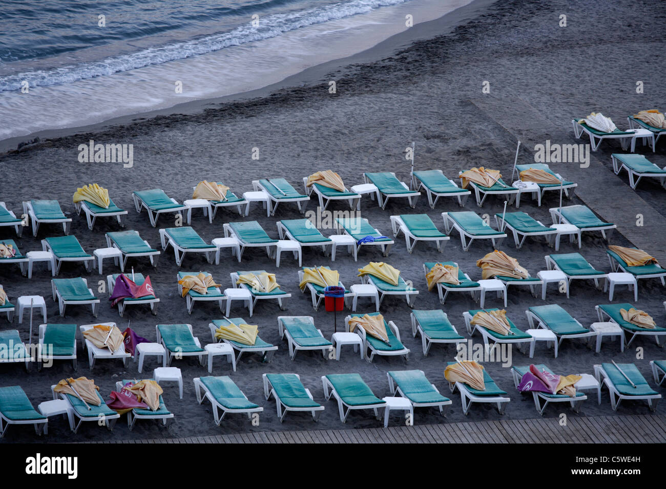 Turkey, Alanya, Sunloungers on beach Stock Photo