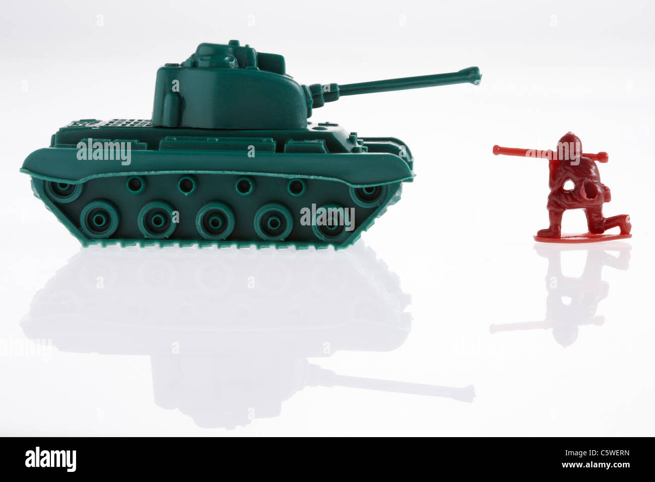 Toy army soldier and toy army tanks Stock Photo