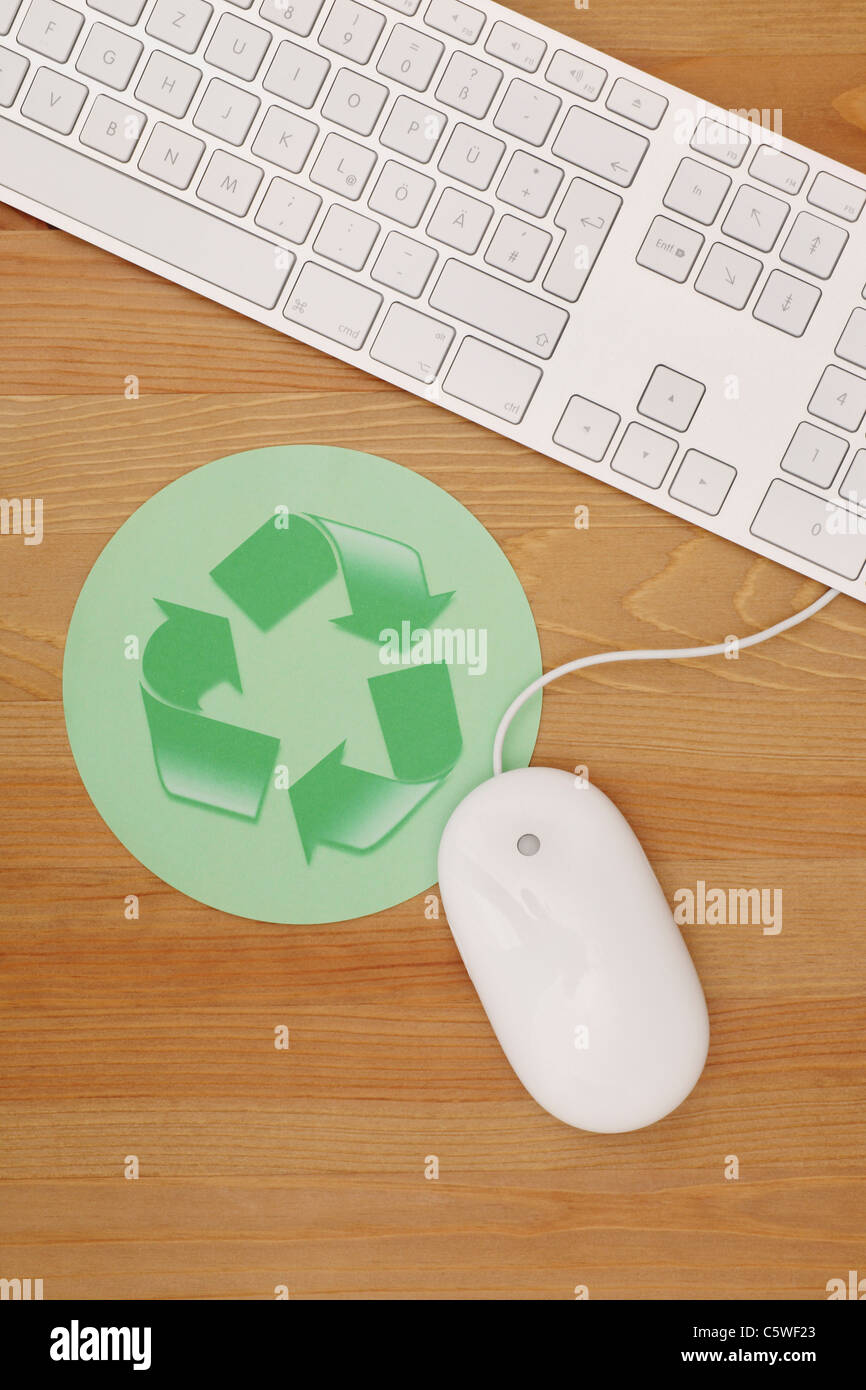 Computer mouse, keypad, mouse pad with recycling symbol, elevated view Stock Photo