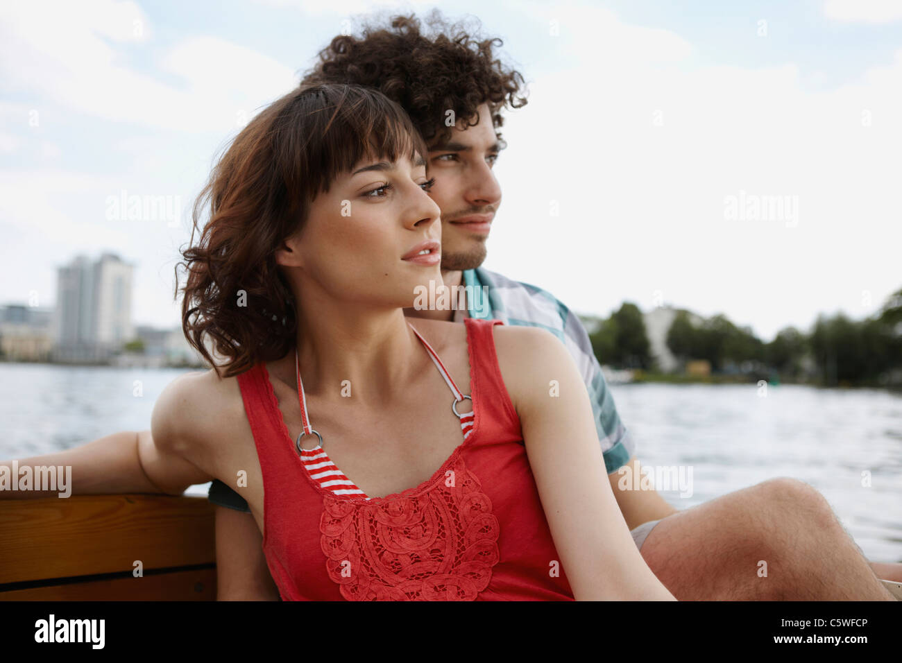 Young man sitting on motorboat hi-res stock photography and images - Alamy