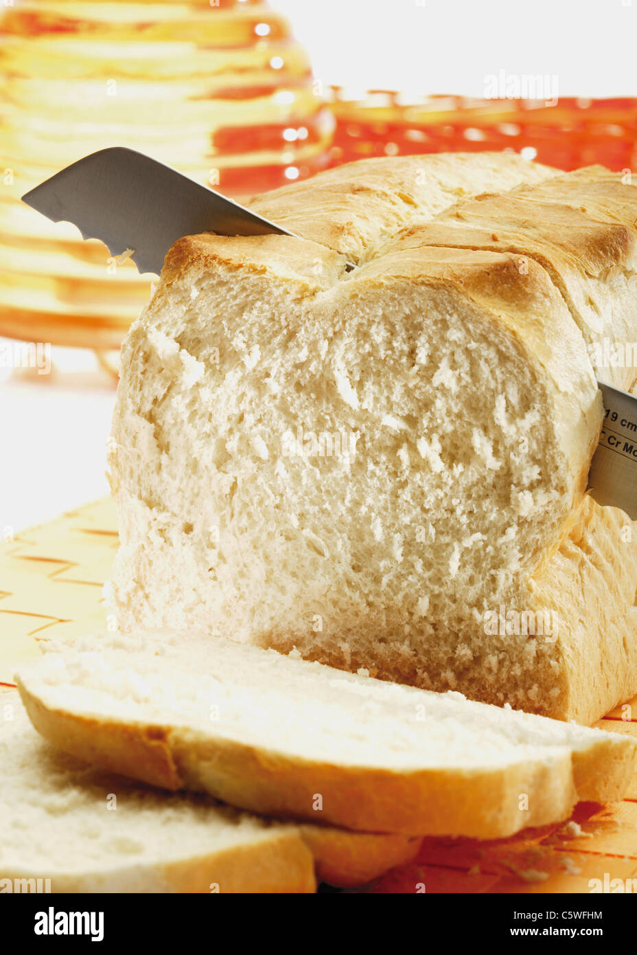 Sliced white bread with knife Stock Photo