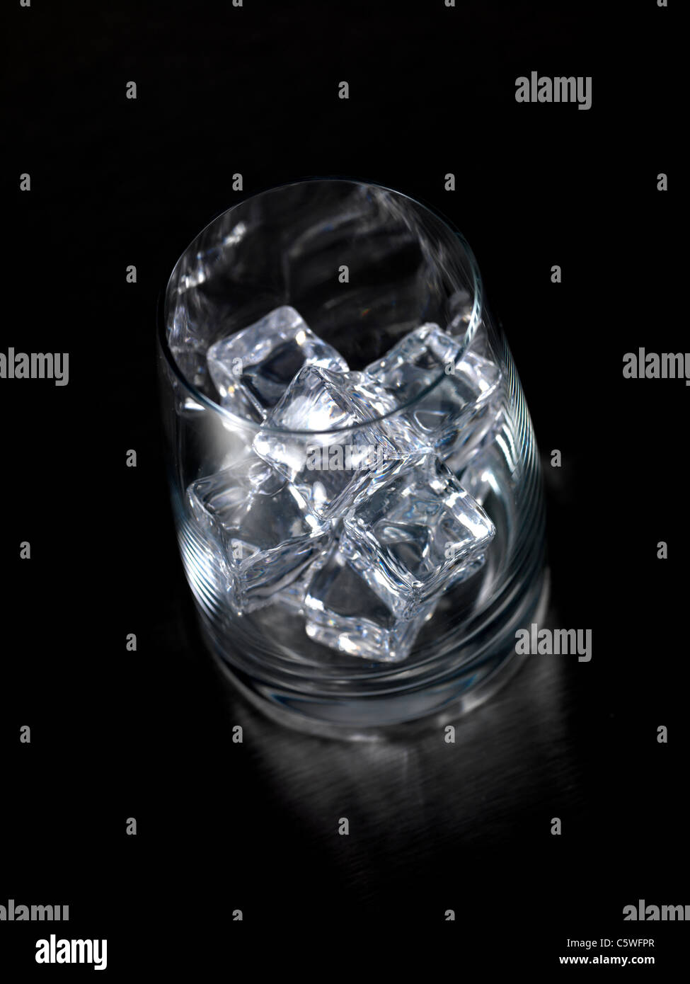 Frozen ice cubes isolated on a kitchen bench Stock Photo - Alamy