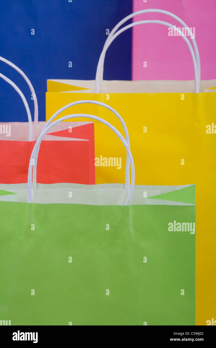 Multicoloured paper shopping bags, full frame, close-up Stock Photo