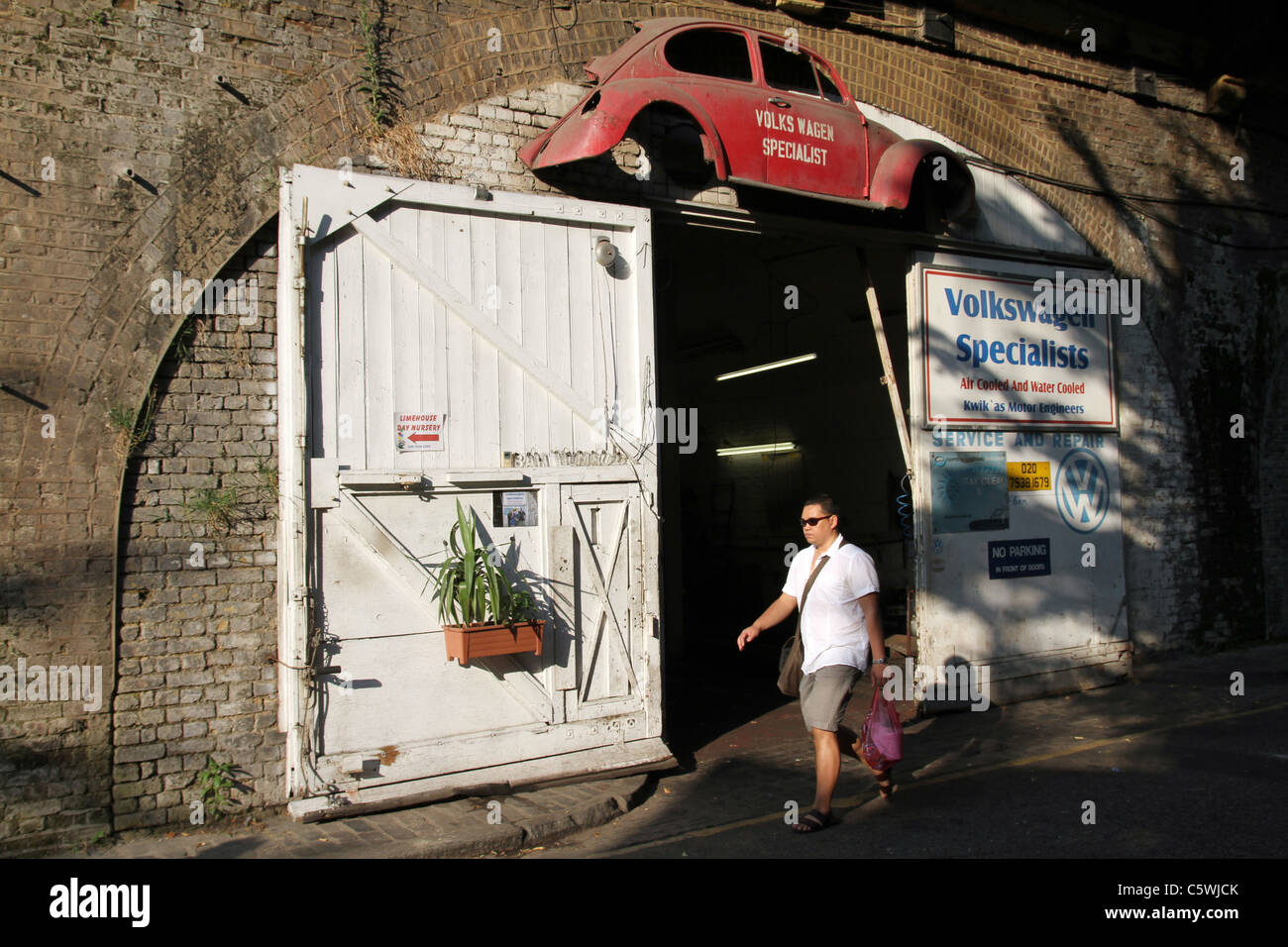 UK. VW repair garage in Poplar, London Stock Photo