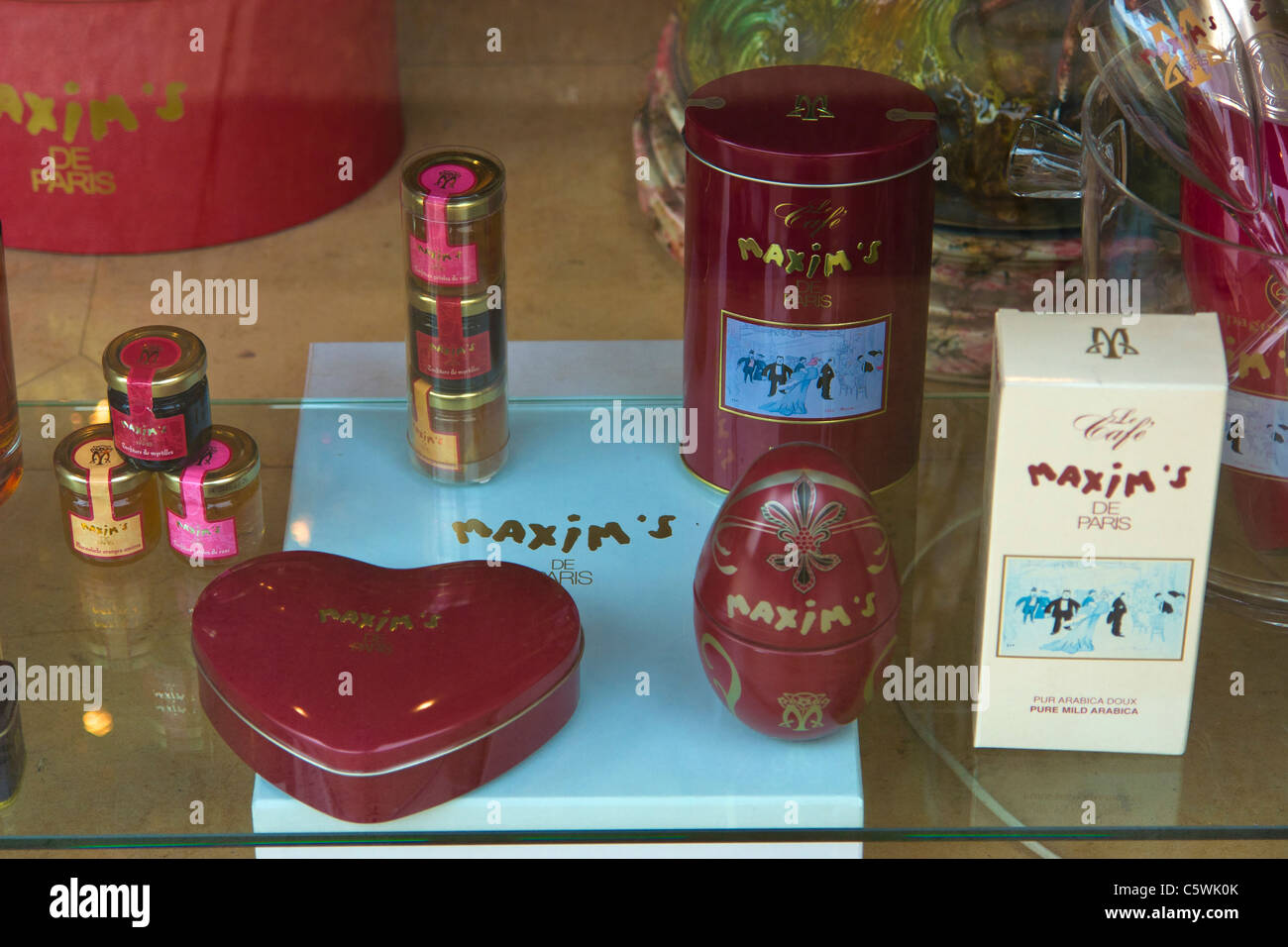 Goods for sale in Maxim's shop, Rue Royale, Paris Stock Photo