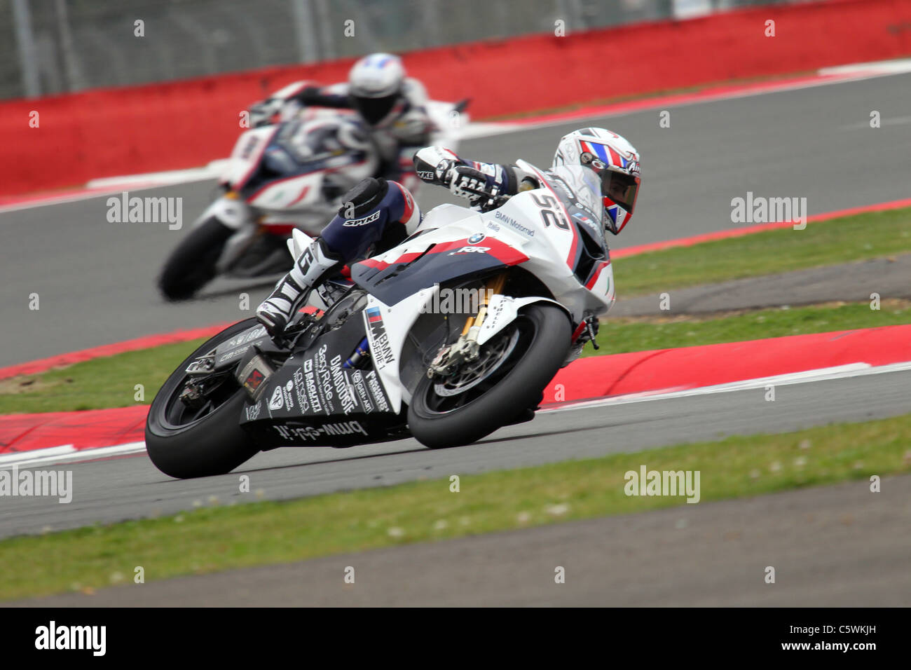 James Toseland leads teammate Leon Haslam through Village complex during second Friday practice at Silverstone Stock Photo