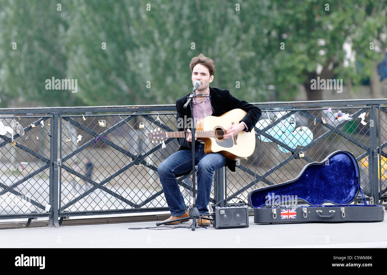 Guitar playing busker in Paris, France Stock Photo