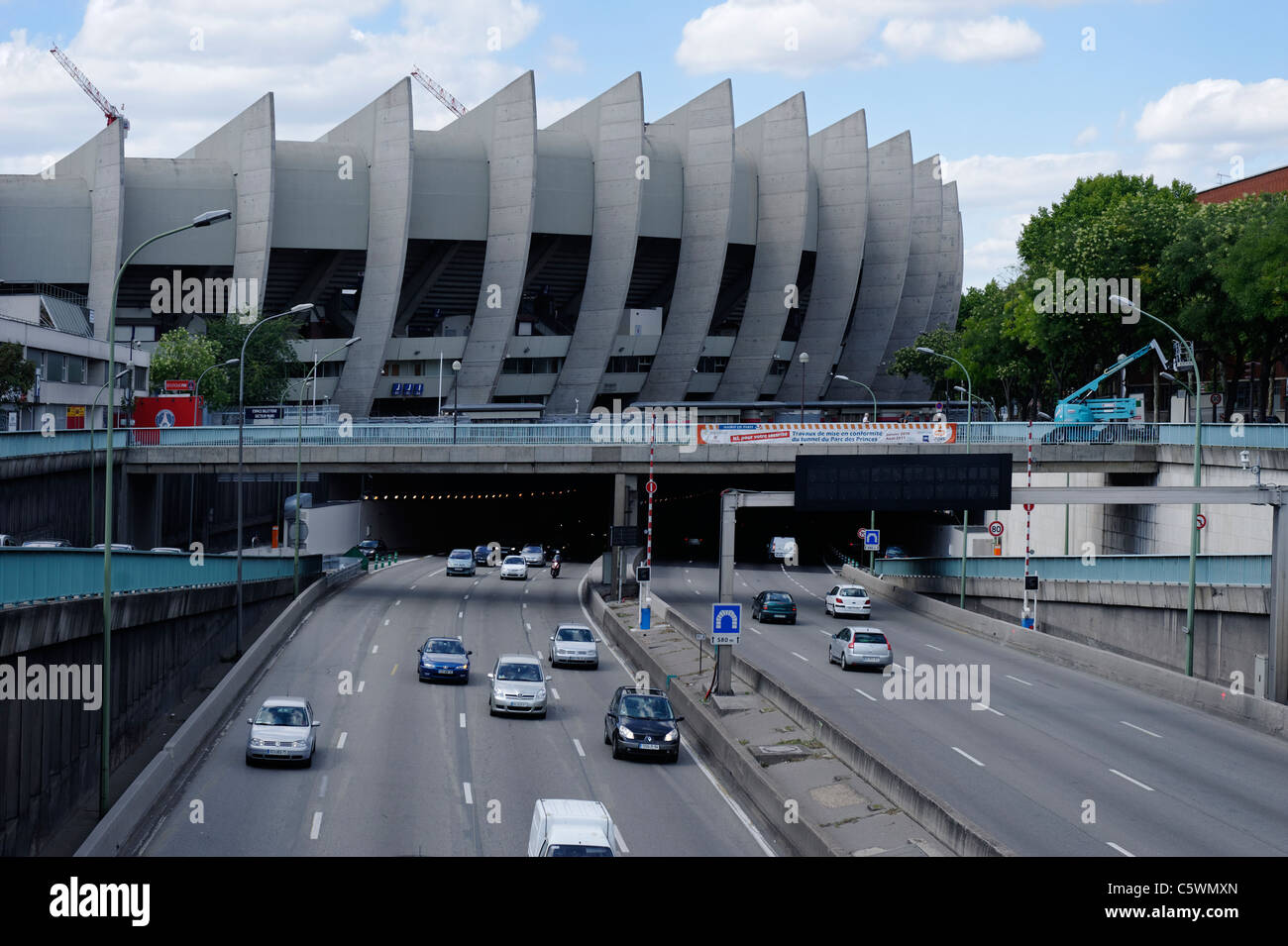 Eight lanes of traffic pass under Paris St Germain club stadium Parc Des Princes in Paris, France. Stock Photo