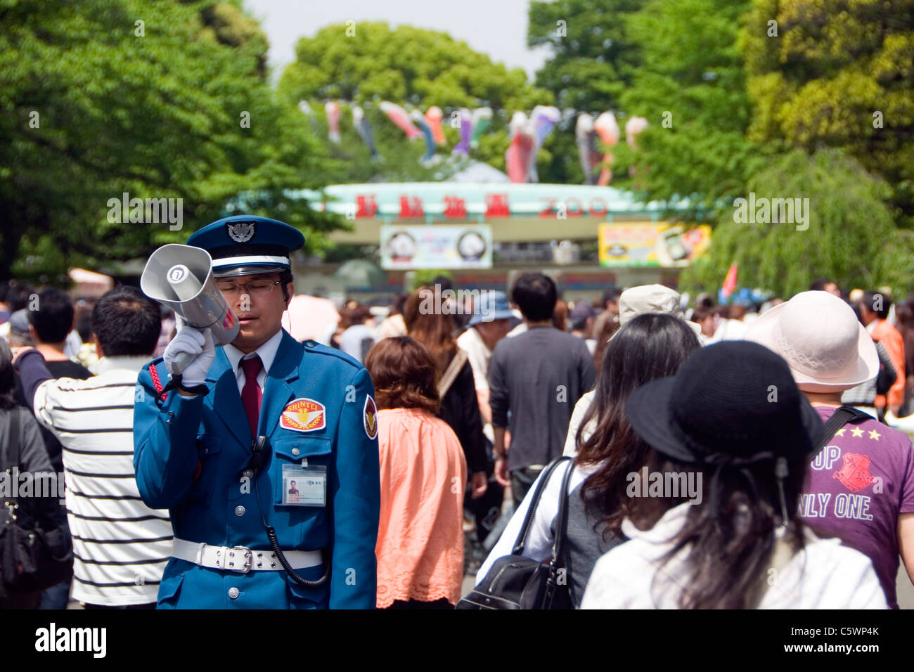 Zoo official addressing a crowd at Ueno Park, Tokyo, Japan. Stock Photo