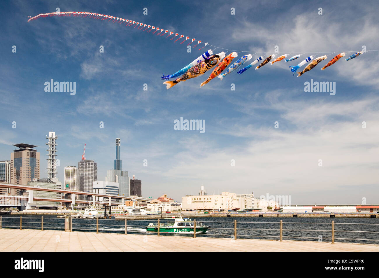 Koinobori flying for Children's Day above Kobe, Japan. Stock Photo
