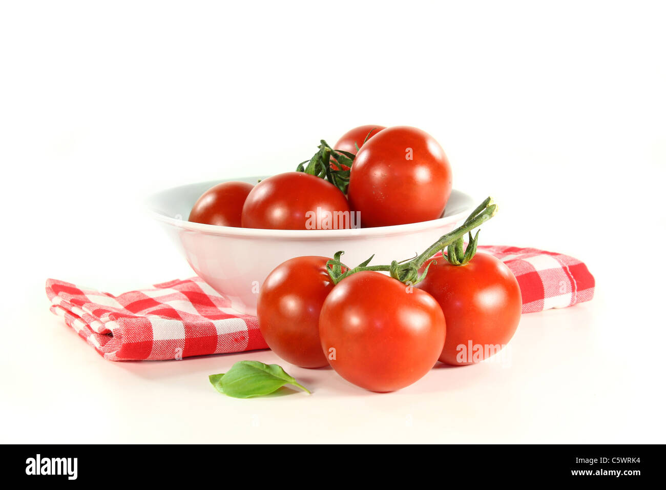 fresh red tomatoes in a white bowl Stock Photo - Alamy