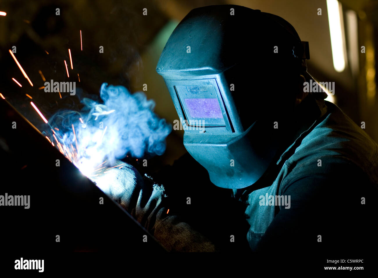 Portrait of a welding process with sparks flying around Stock Photo