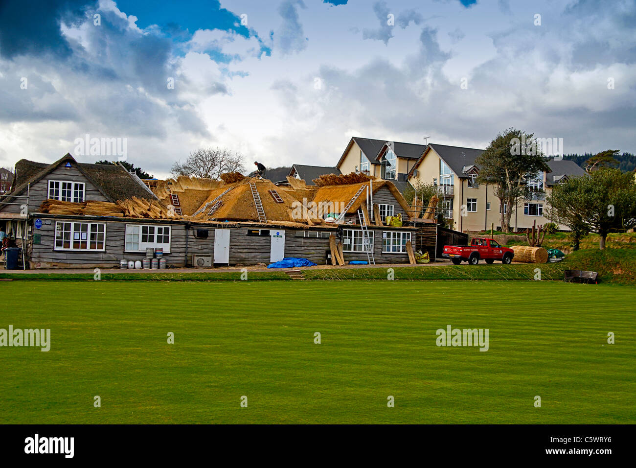 The club house pavilion of Sidmouth Cricket Club being re-thatched, Devon , England, UK Stock Photo