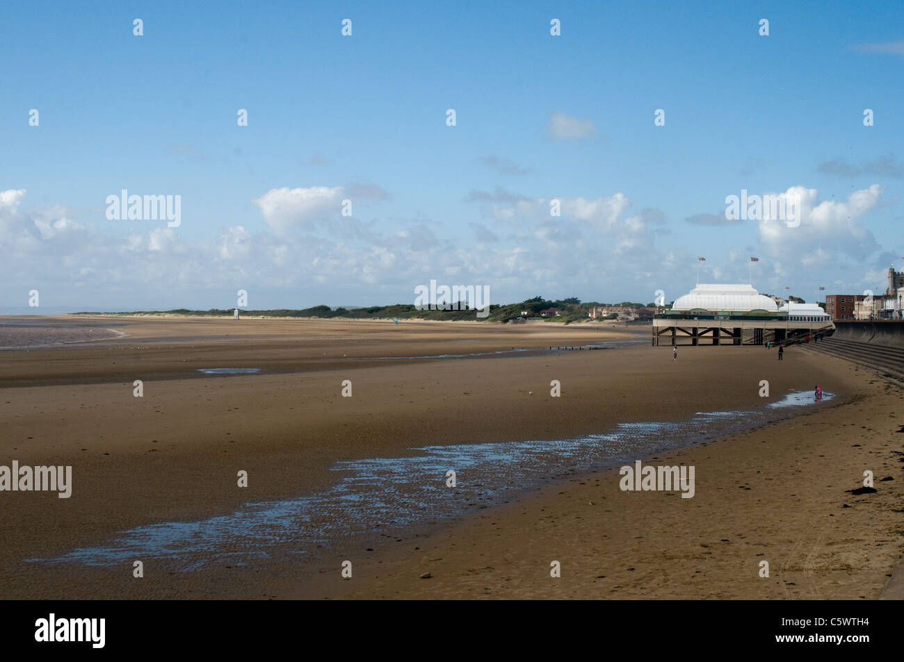 The wide sandy beach at Burnham-on-Sea, Somerset. it is a sunny windy day and the beach is almost deserted. Stock Photo