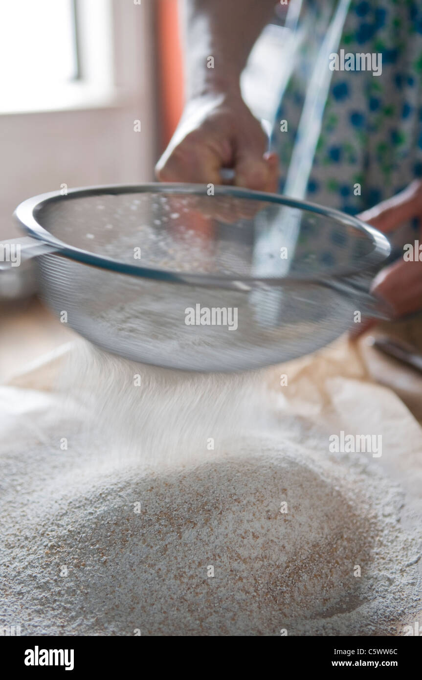 Sifting whole wheat flour Stock Photo Alamy