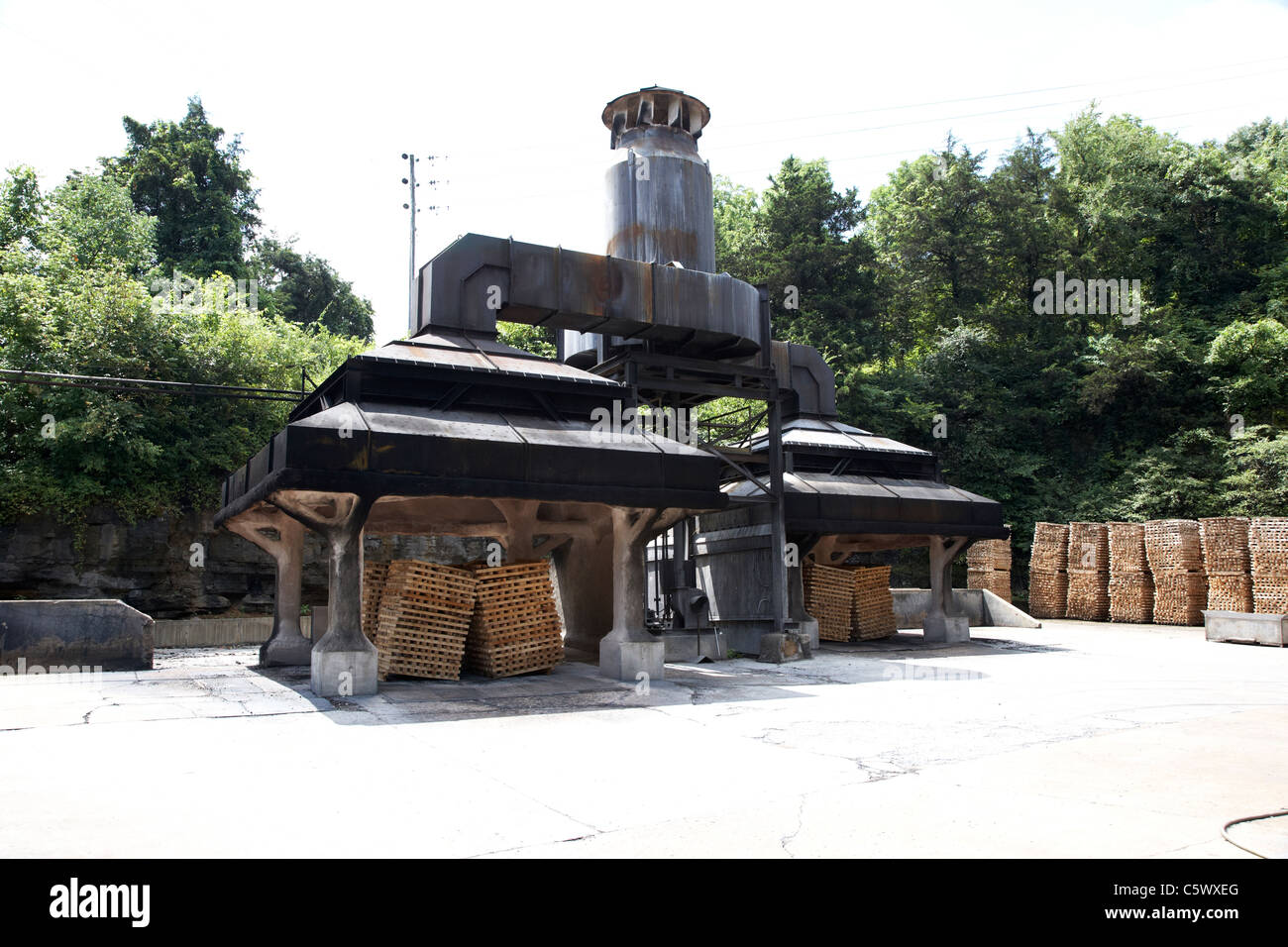 piles of maple wood ready for burning to turn into filter charcoal in the rickyard jack daniels distillery Lynchburg , tennessee Stock Photo