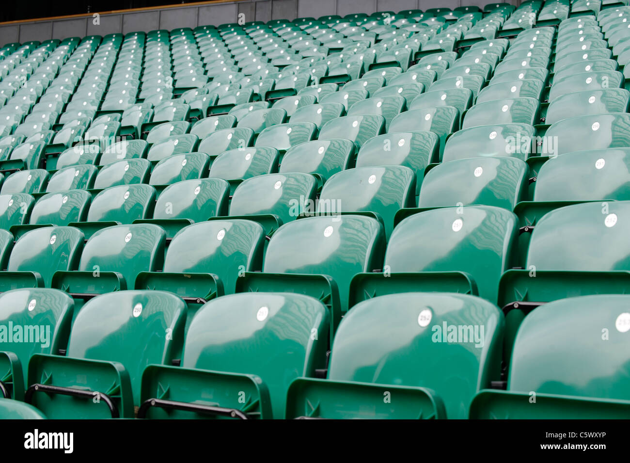 Rows of green plastic seats at the Twickenham Rugby stadium, home of the England Rugby Union team. Stock Photo