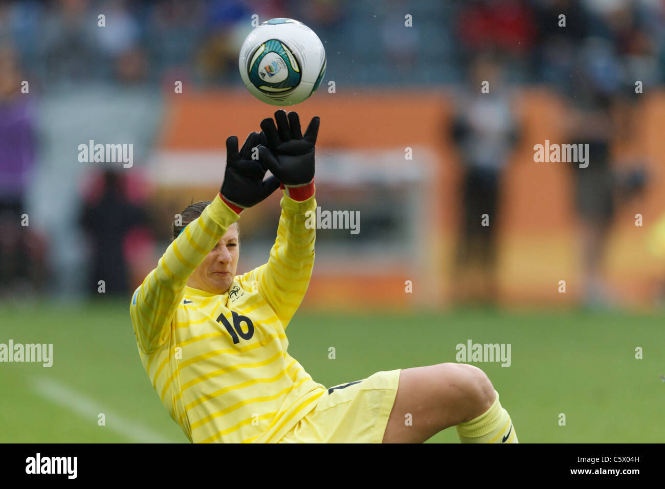France goalkeeper Berangere Sapowicz tries to save a shot from Alex Morgan of the USA during a 2011 Women's World Cup match. Stock Photo