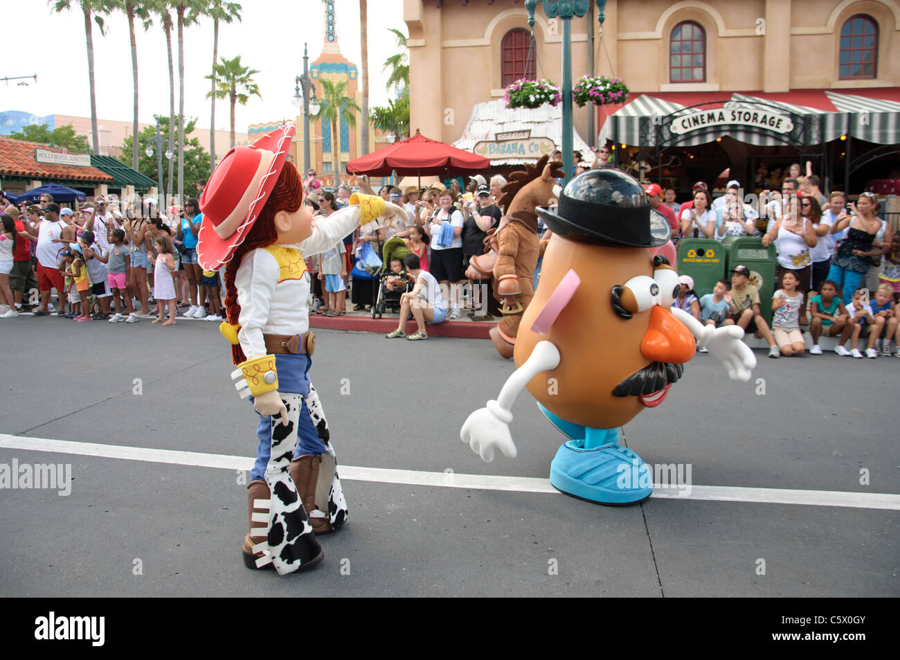 jessie and mr potato head in disneys countdown to fun parade in hollywood studios orlando florida Stock Photo