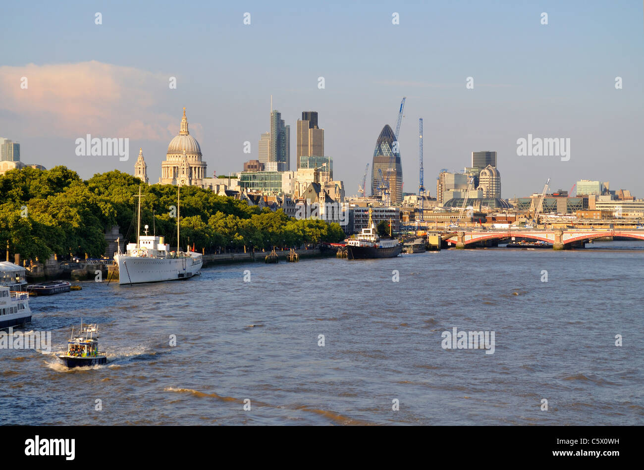 A river police boat making its way down the River Thames past the Victoria Embankment in the City of London Stock Photo