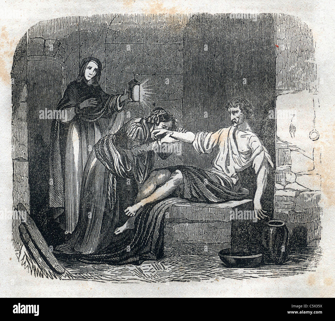 A condemned man receives a small amount of succor in his cell - Woodcut image from antiquarian book, Mysteries of the Inquisition, 1845 Stock Photo