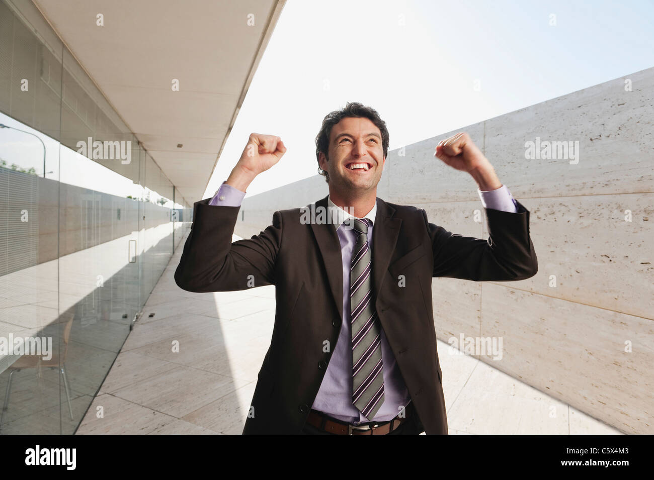Spain, Mallorca, Businessmann cheering, portrait Stock Photo