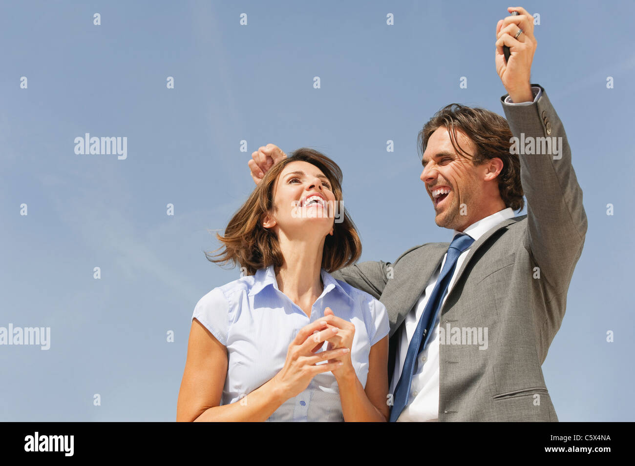 Business people cheering Stock Photo - Alamy