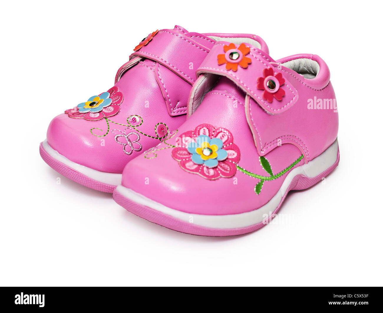 Shoes for little girls decorated with flowers isolated on white background Stock Photo