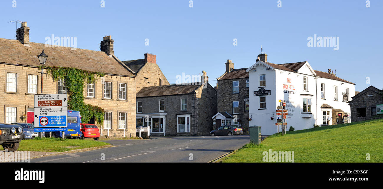 The Buck Hotel at the road junction to Arkengarthdale and Upper Swaledale, Reeth, Yorkshire, England Stock Photo