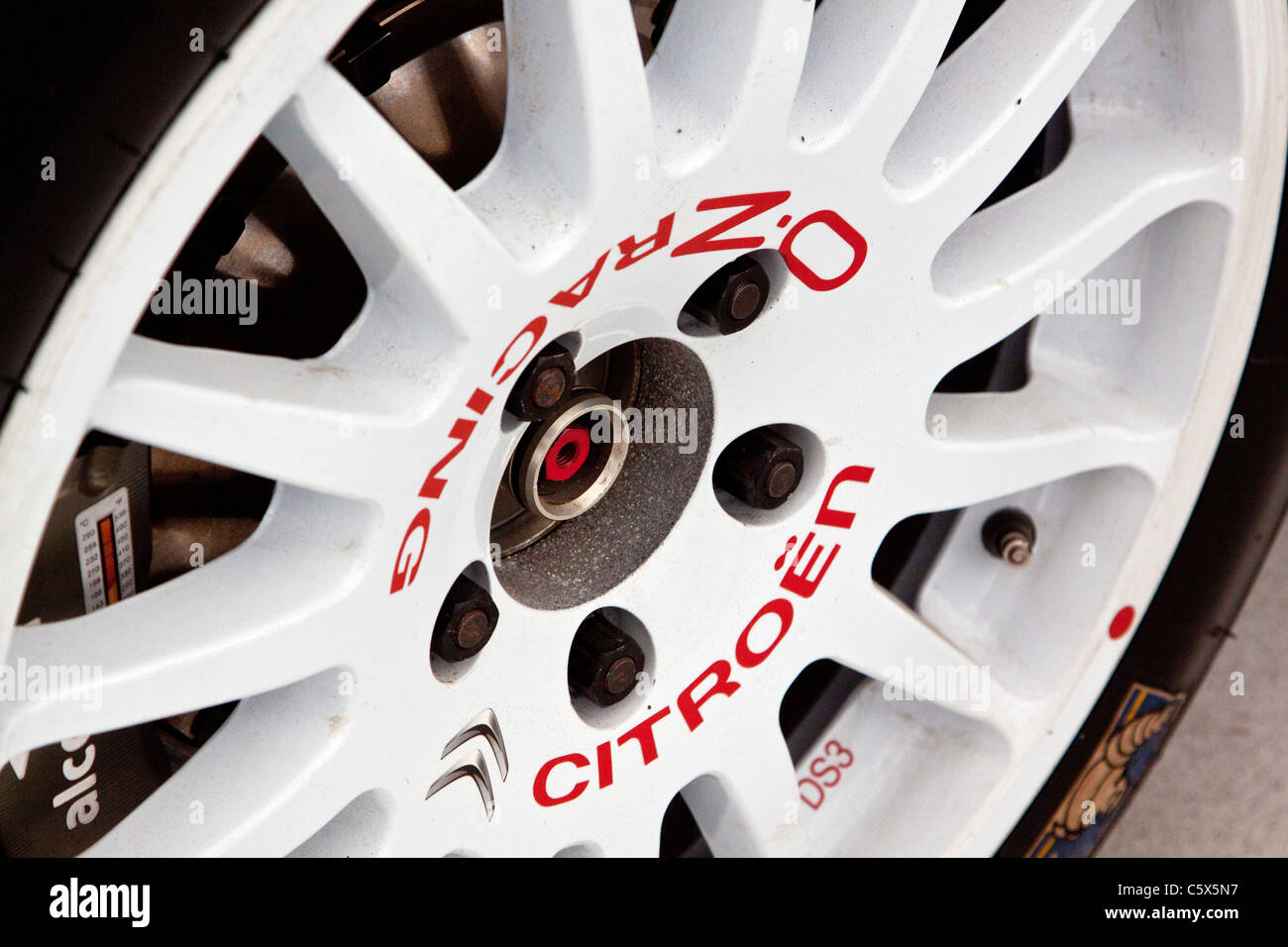 The front white alloy wheel of the Citroen DS3 WRC Rally Car for 2011