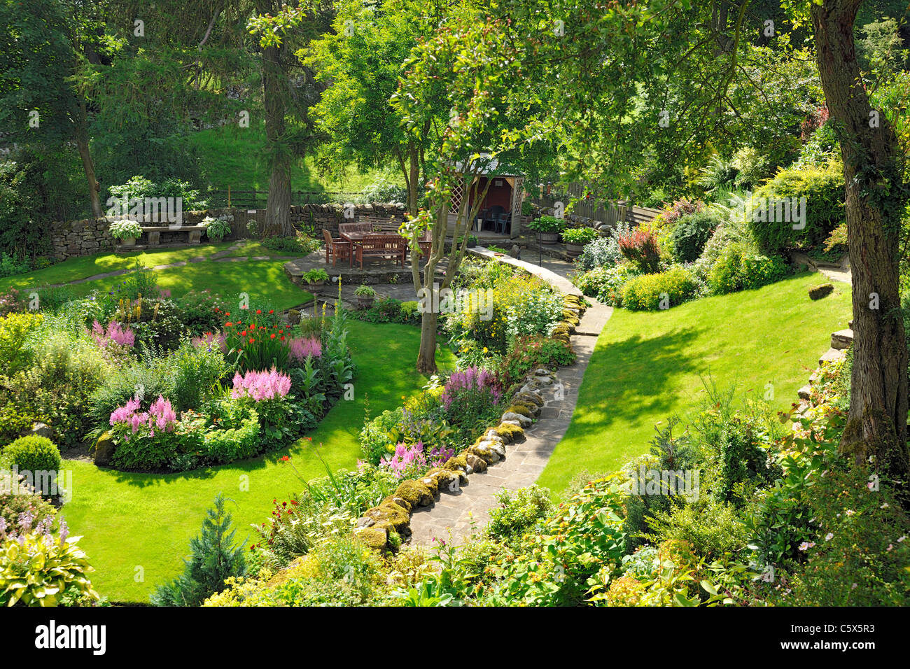 An eye-catching, peaceful and secluded cottage garden in Grinton, Swaledale, North Yorkshire, England Stock Photo