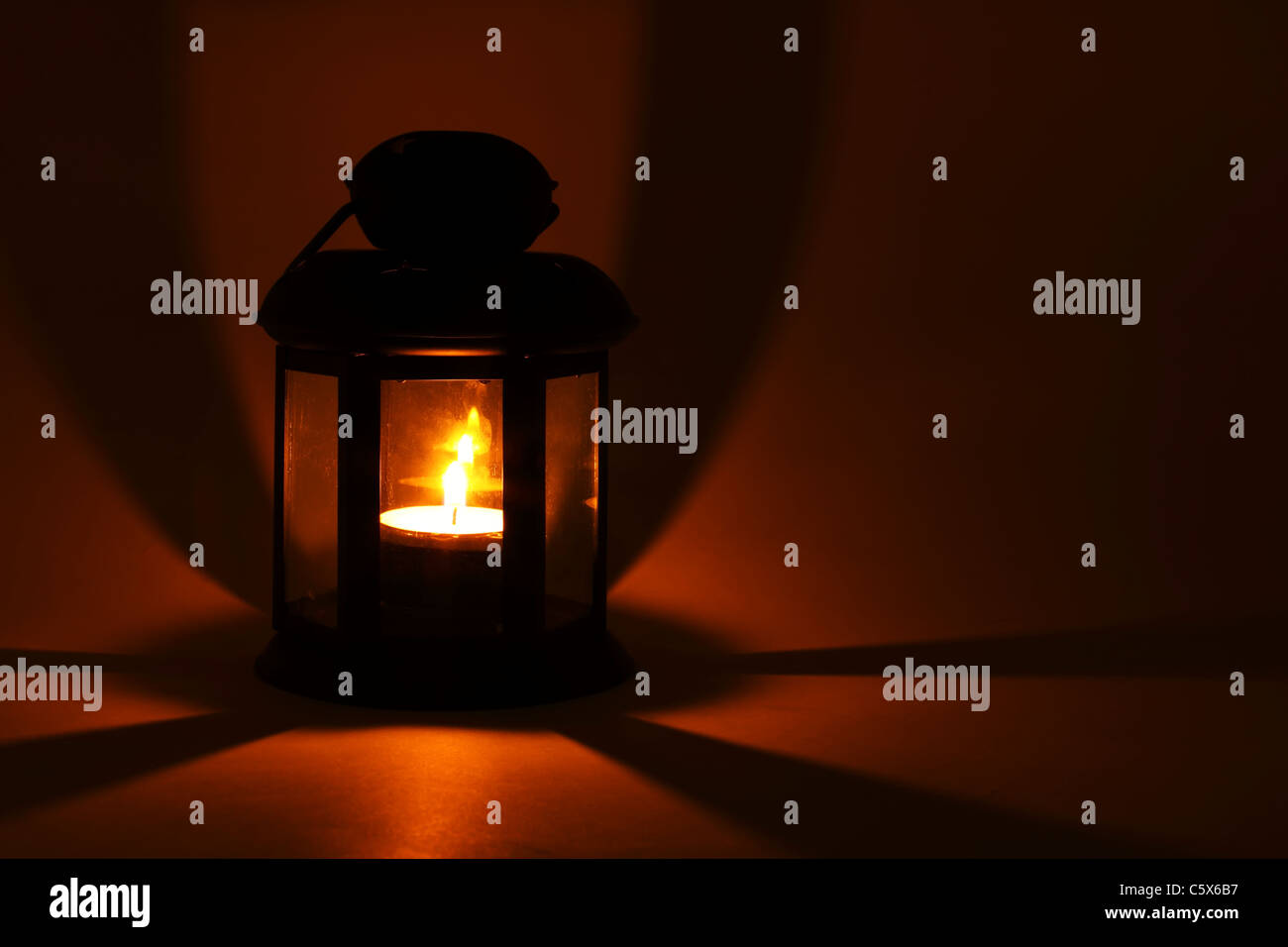 Lantern with burning candle in the dark Stock Photo Alamy