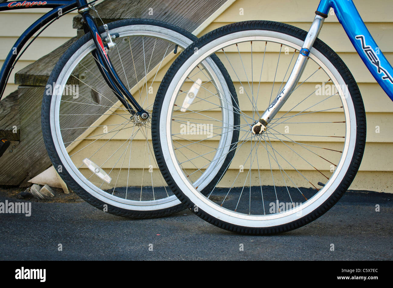 Front wheels of two beach bicycles. Stock Photo